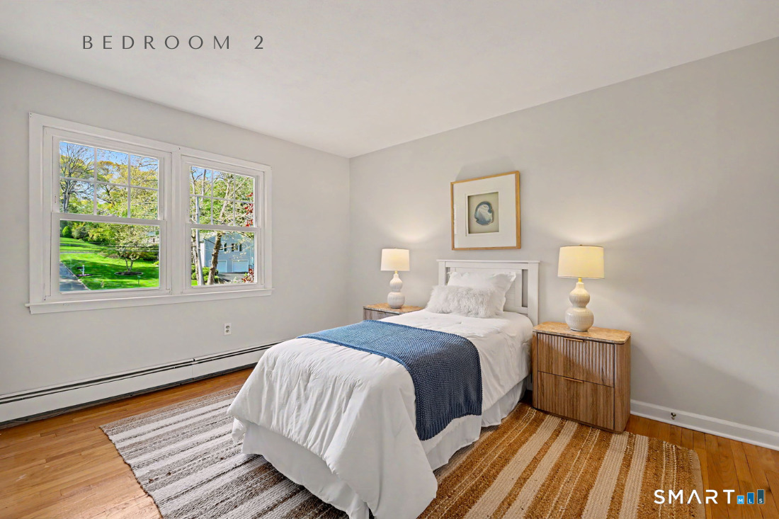 370 Nepas Road Fairfield, CT 06825 - Photo 19 of 32 a bedroom with a bed and a window