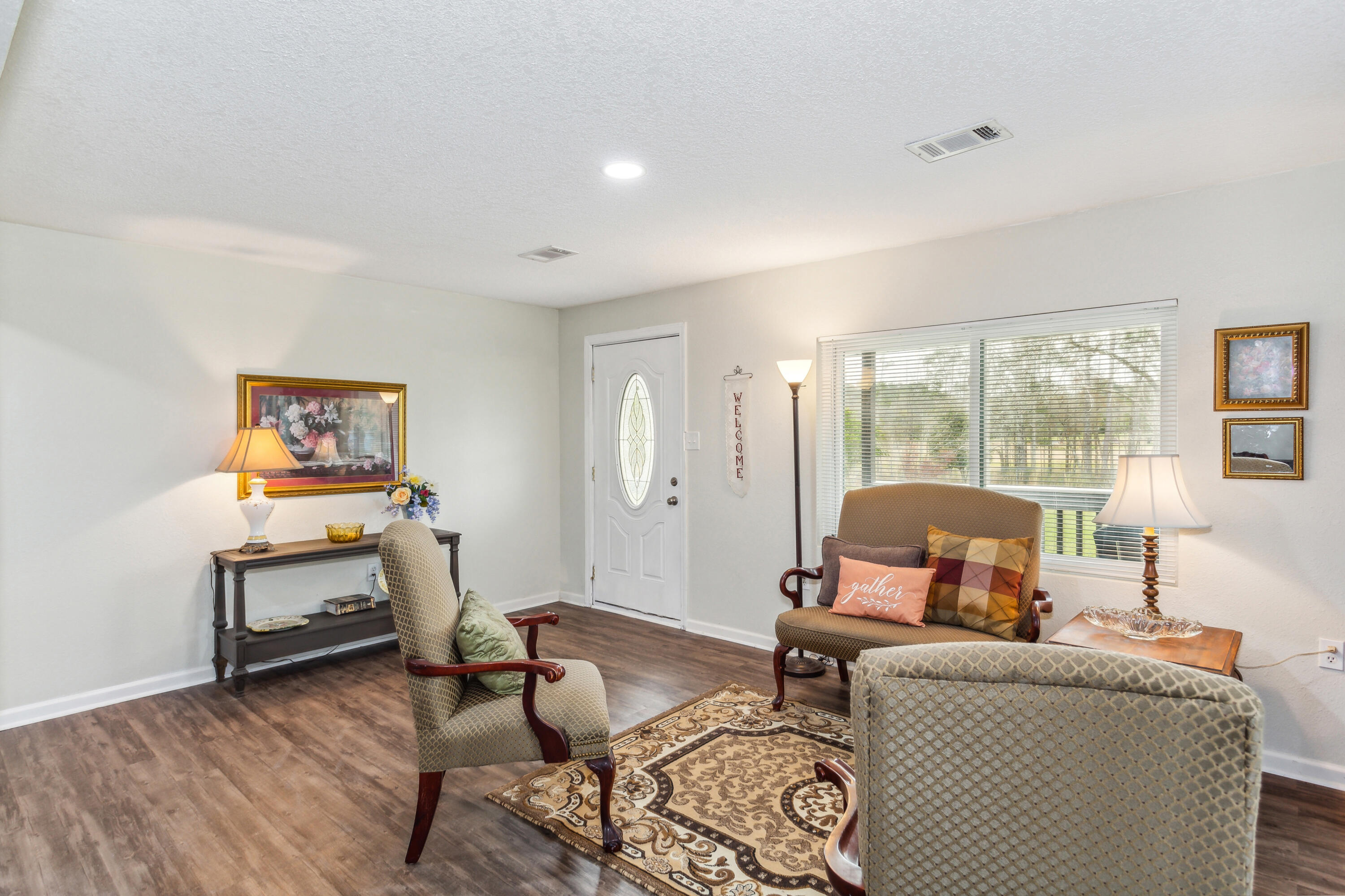 1956 Well Line Road Cantonment, FL 32533 - Photo 12 of 29 a living room with furniture and a window