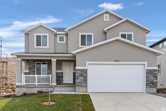 387 Slant Road, Unit 30 Spanish Fork, UT 84660 - Photo 1 of 25 Contemporary two-story residence featuring a combination of stucco and stone veneer siding