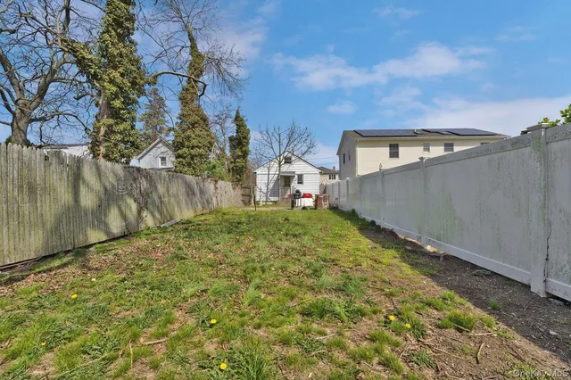 a view of a back yard of the house