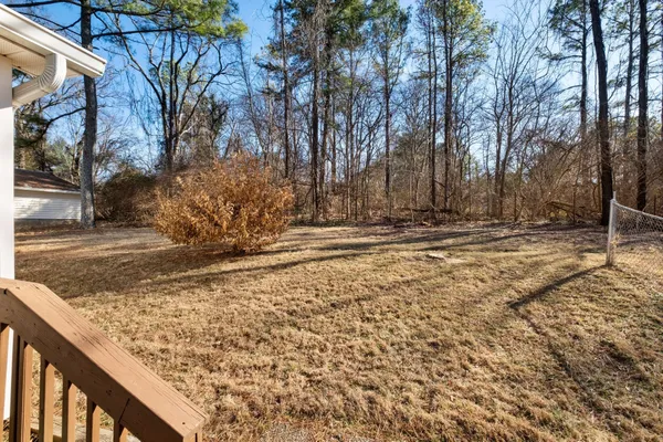a view of the backyard of the house