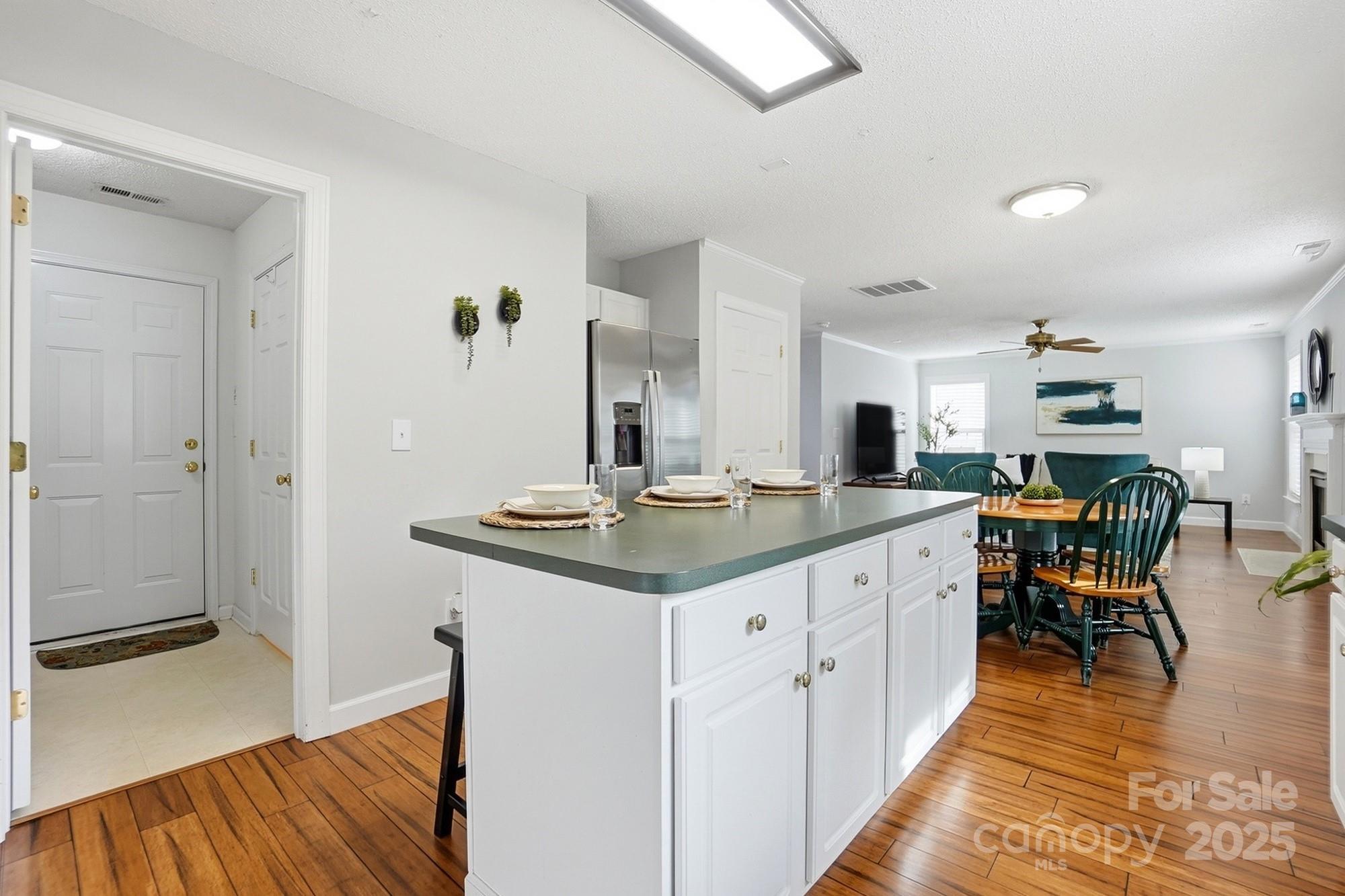 143 Amber Woods Drive Tega Cay, SC 29708 - Photo 15 of 46 a kitchen with stainless steel appliances granite countertop a sink and a refrigerator