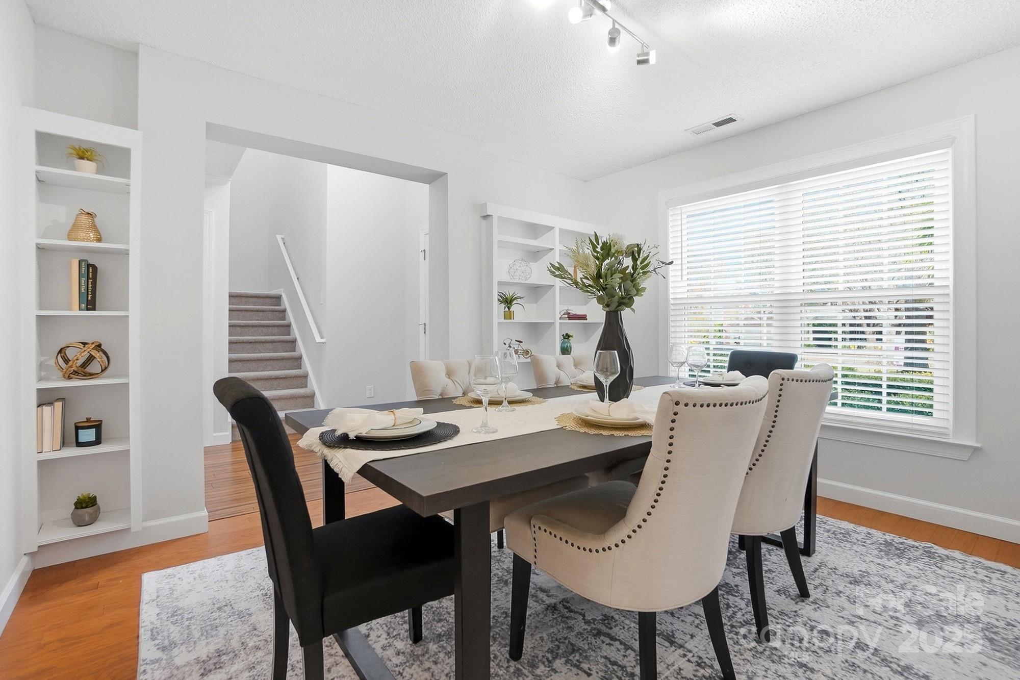 143 Amber Woods Drive Tega Cay, SC 29708 - Photo 19 of 46 a dining room with furniture and window