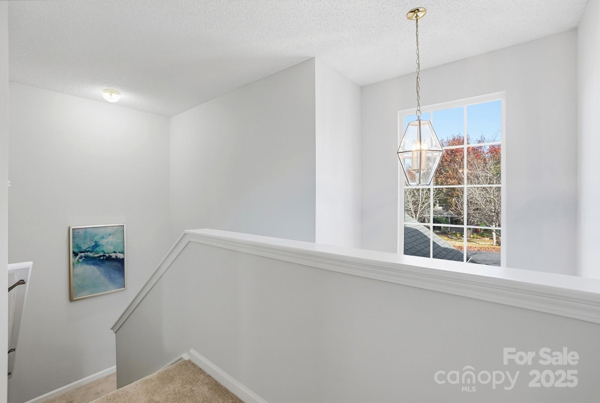 143 Amber Woods Drive Tega Cay, SC 29708 - Photo 23 of 46 a view of an empty room with a window