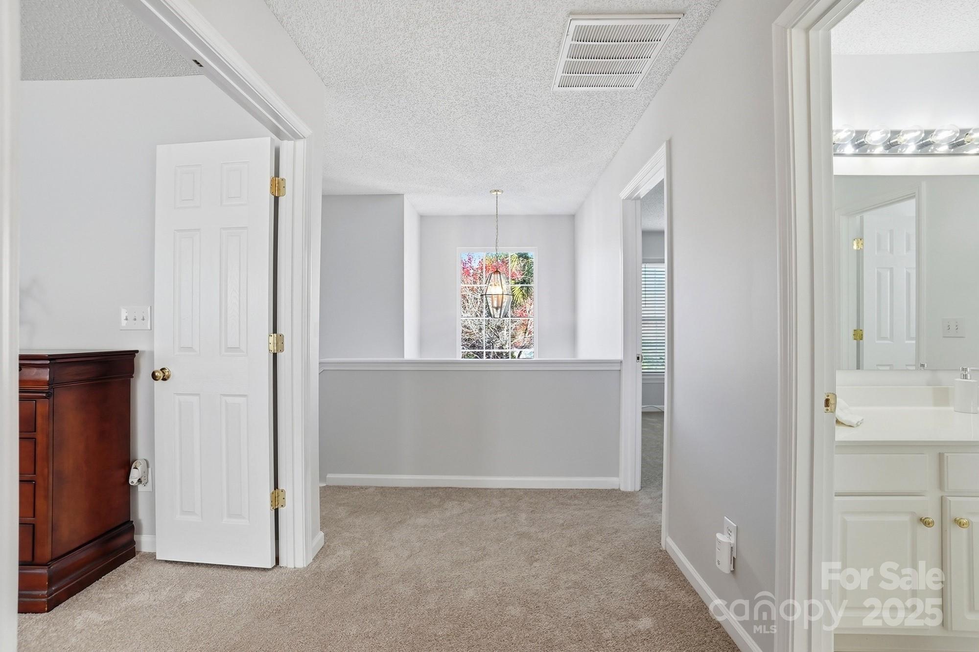143 Amber Woods Drive Tega Cay, SC 29708 - Photo 24 of 46 a view of an entryway with wooden floor