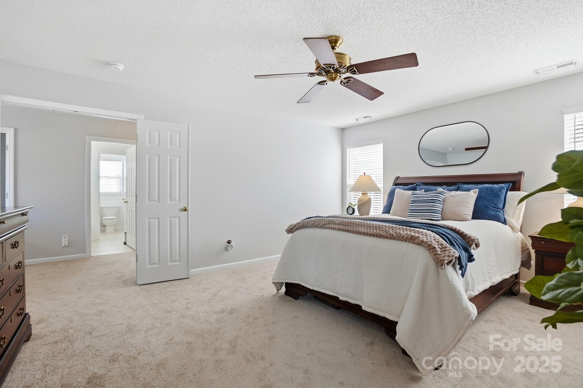 143 Amber Woods Drive Tega Cay, SC 29708 - Photo 26 of 46 a bedroom with a bed and window