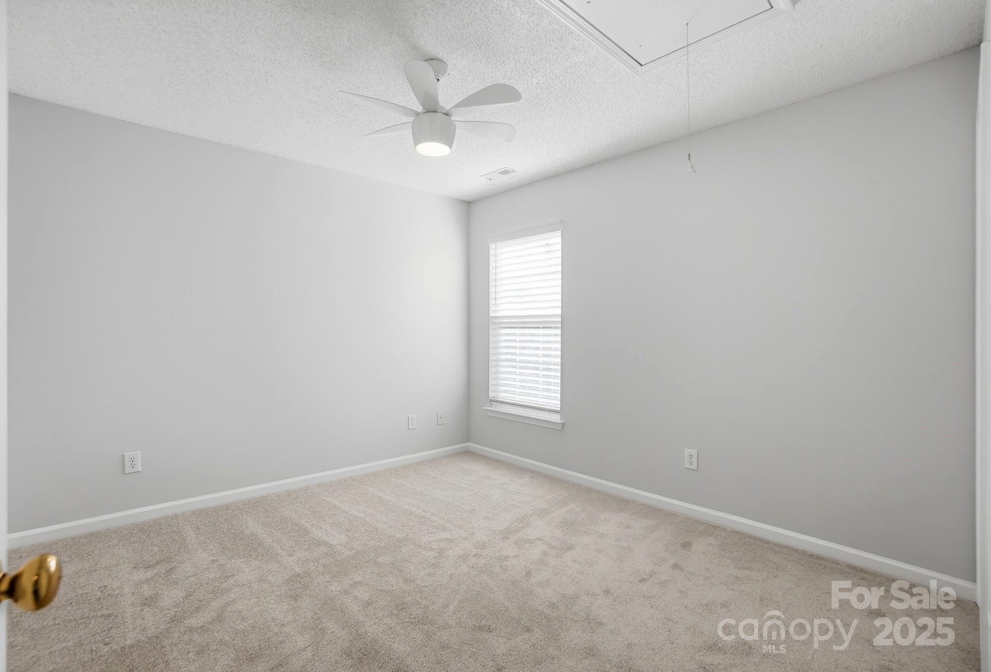 143 Amber Woods Drive Tega Cay, SC 29708 - Photo 30 of 46 an empty room with a window