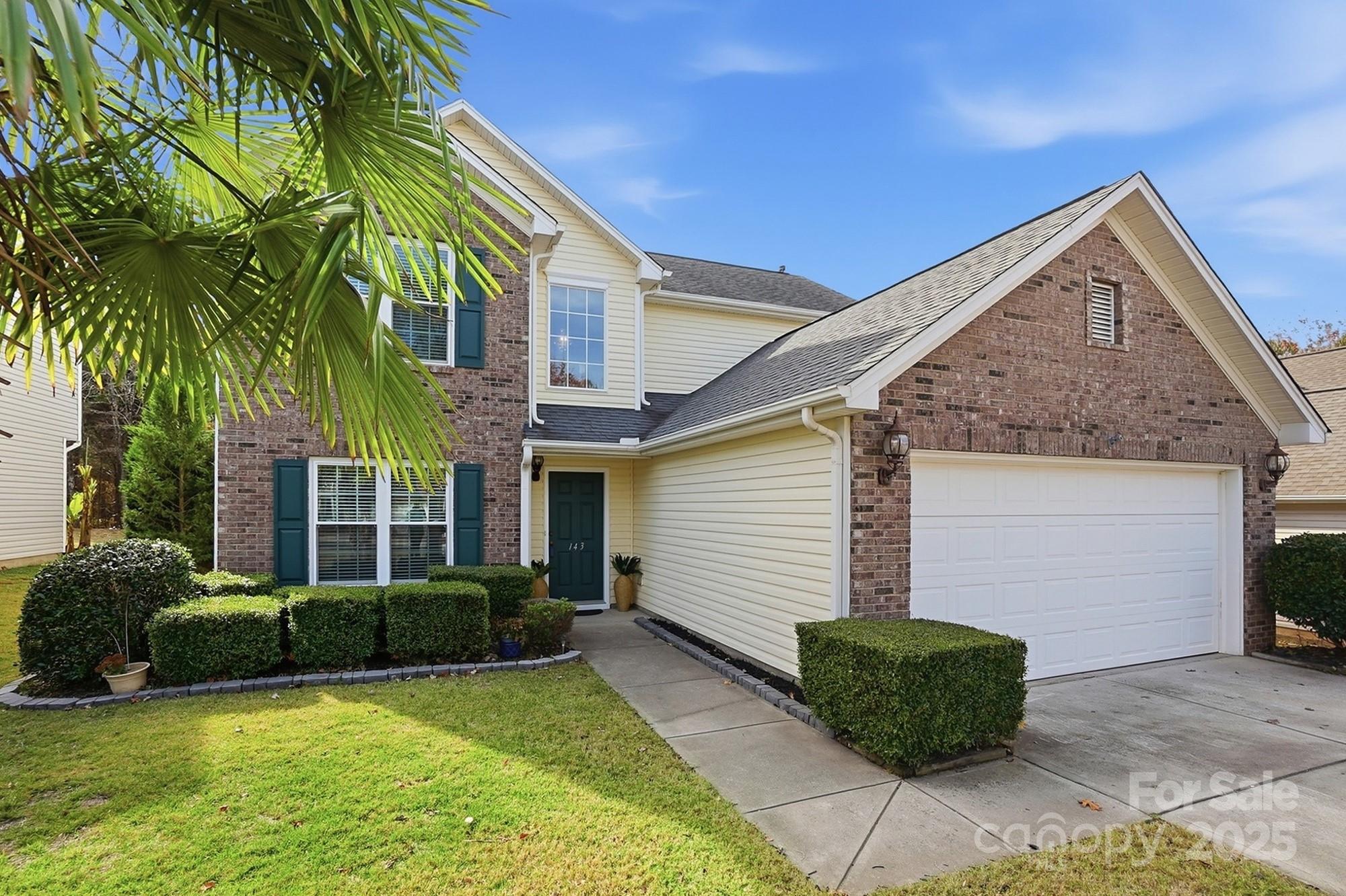 143 Amber Woods Drive Tega Cay, SC 29708 - Photo 3 of 46 a view of house with backyard