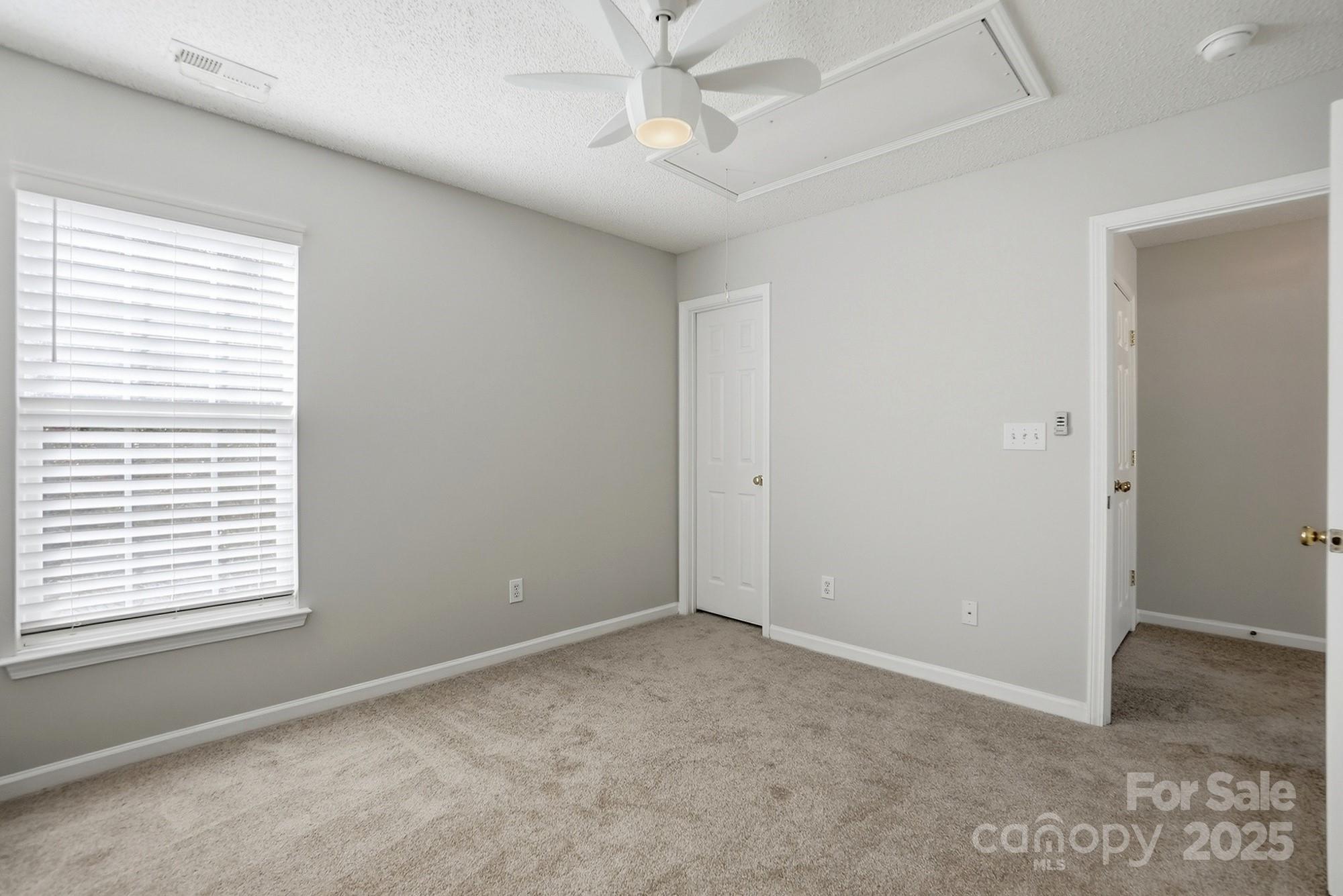143 Amber Woods Drive Tega Cay, SC 29708 - Photo 32 of 46 a view of an empty room with a window