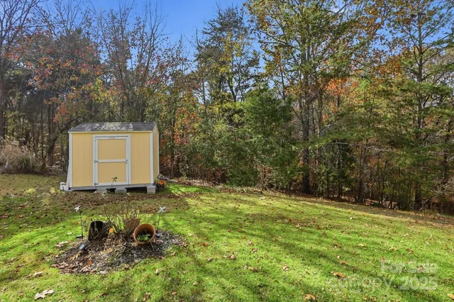 a backyard of a house with lots of green space