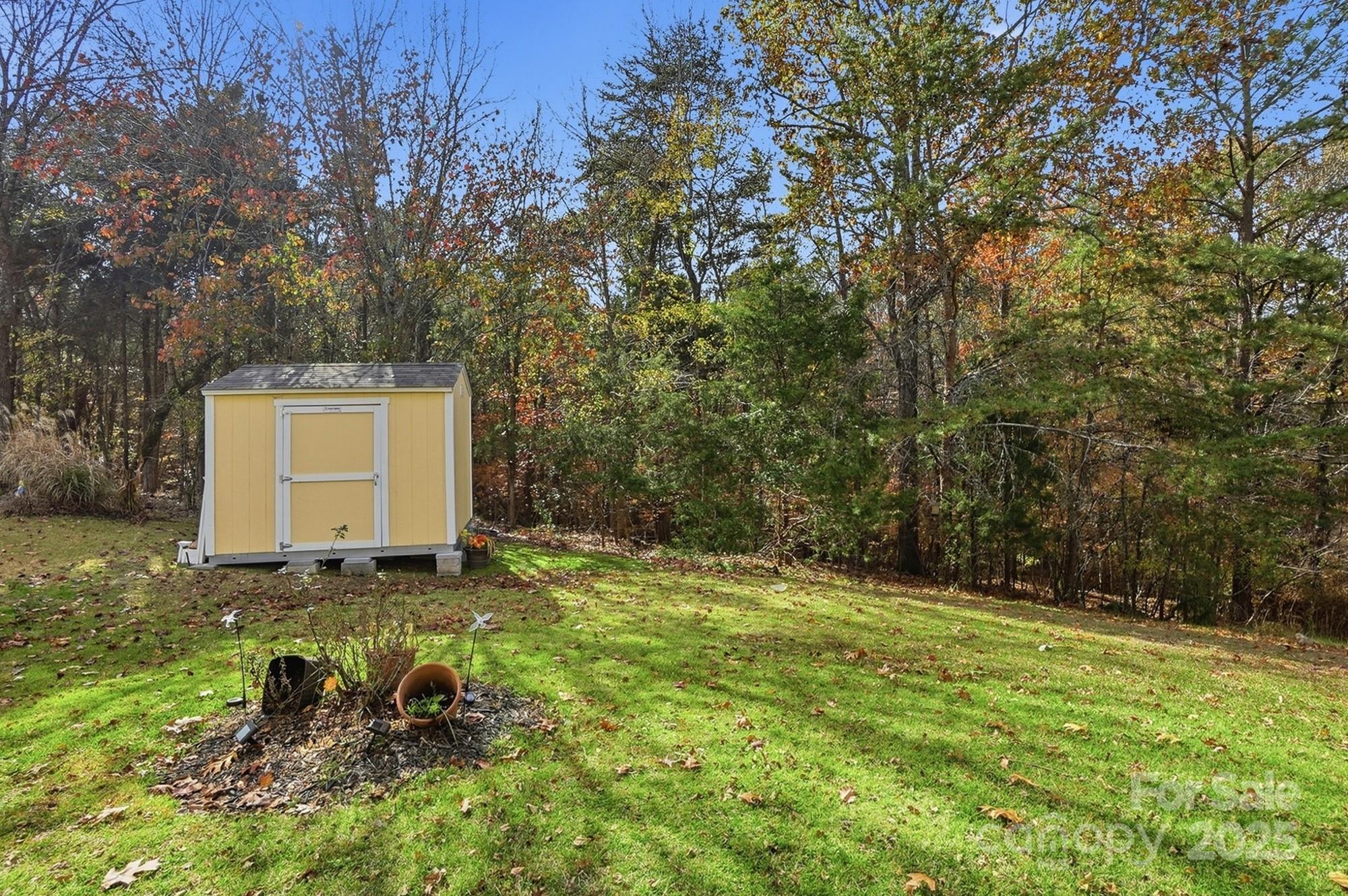 143 Amber Woods Drive Tega Cay, SC 29708 - Photo 41 of 46 a backyard of a house with lots of green space