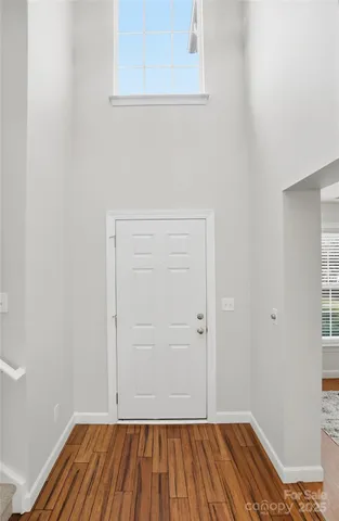 a view of room with wooden floor and closet