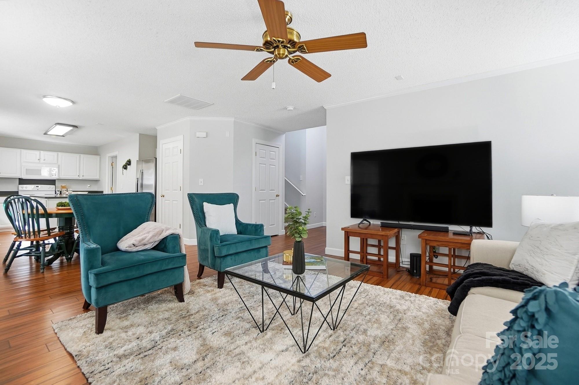 143 Amber Woods Drive Tega Cay, SC 29708 - Photo 8 of 46 a living room with furniture and a flat screen tv
