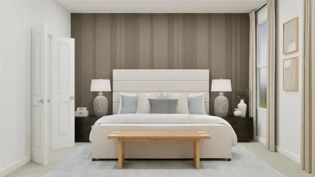 a bedroom with bed and a potted plant