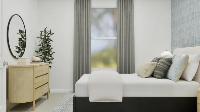 a bedroom with a bed and a mirror