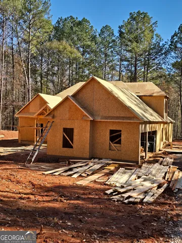 a house with trees in the background