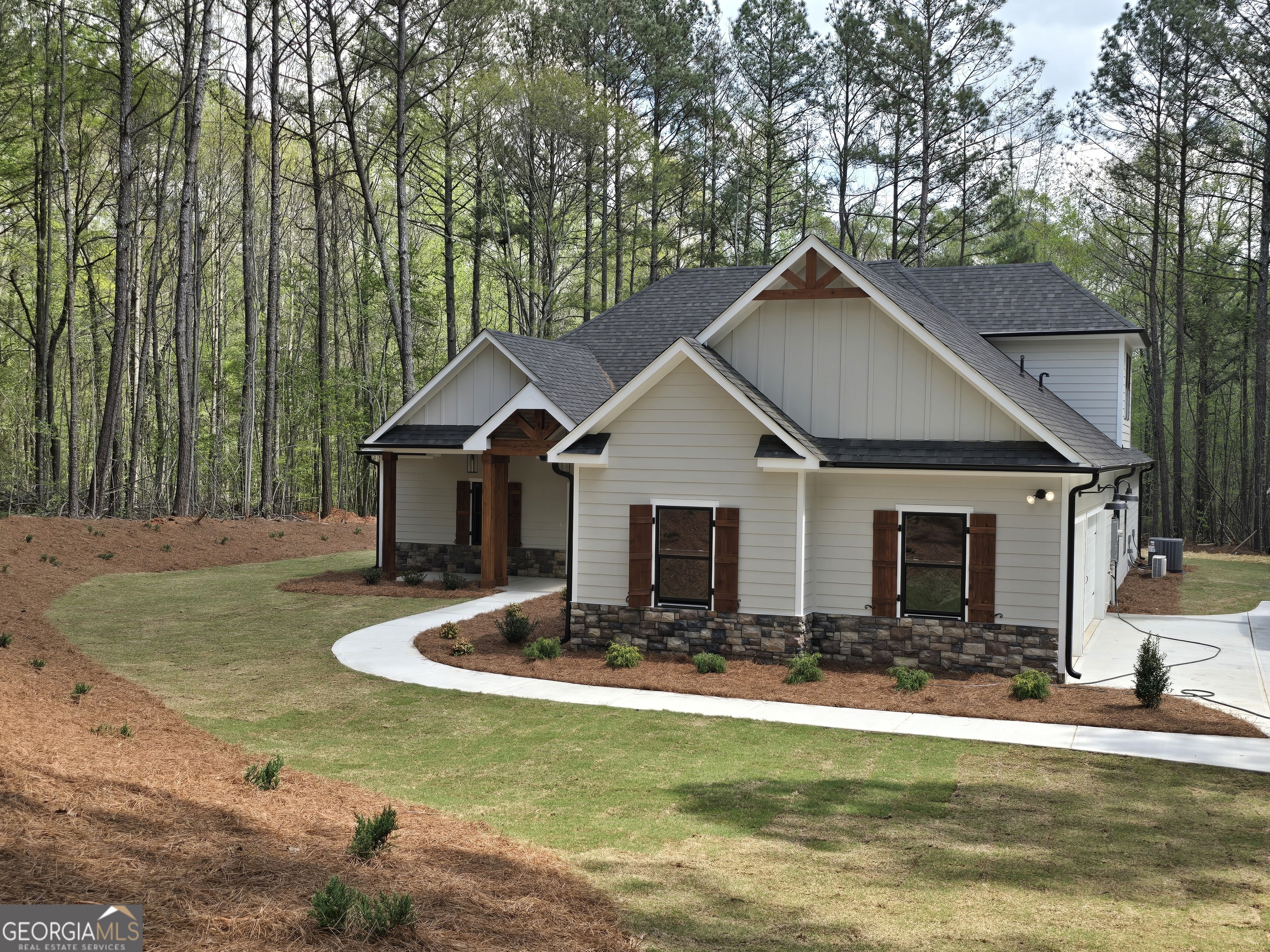 1620 Bar J Road Temple, GA 30179 - Photo 2 of 73 a front view of house with yard and trees in the background
