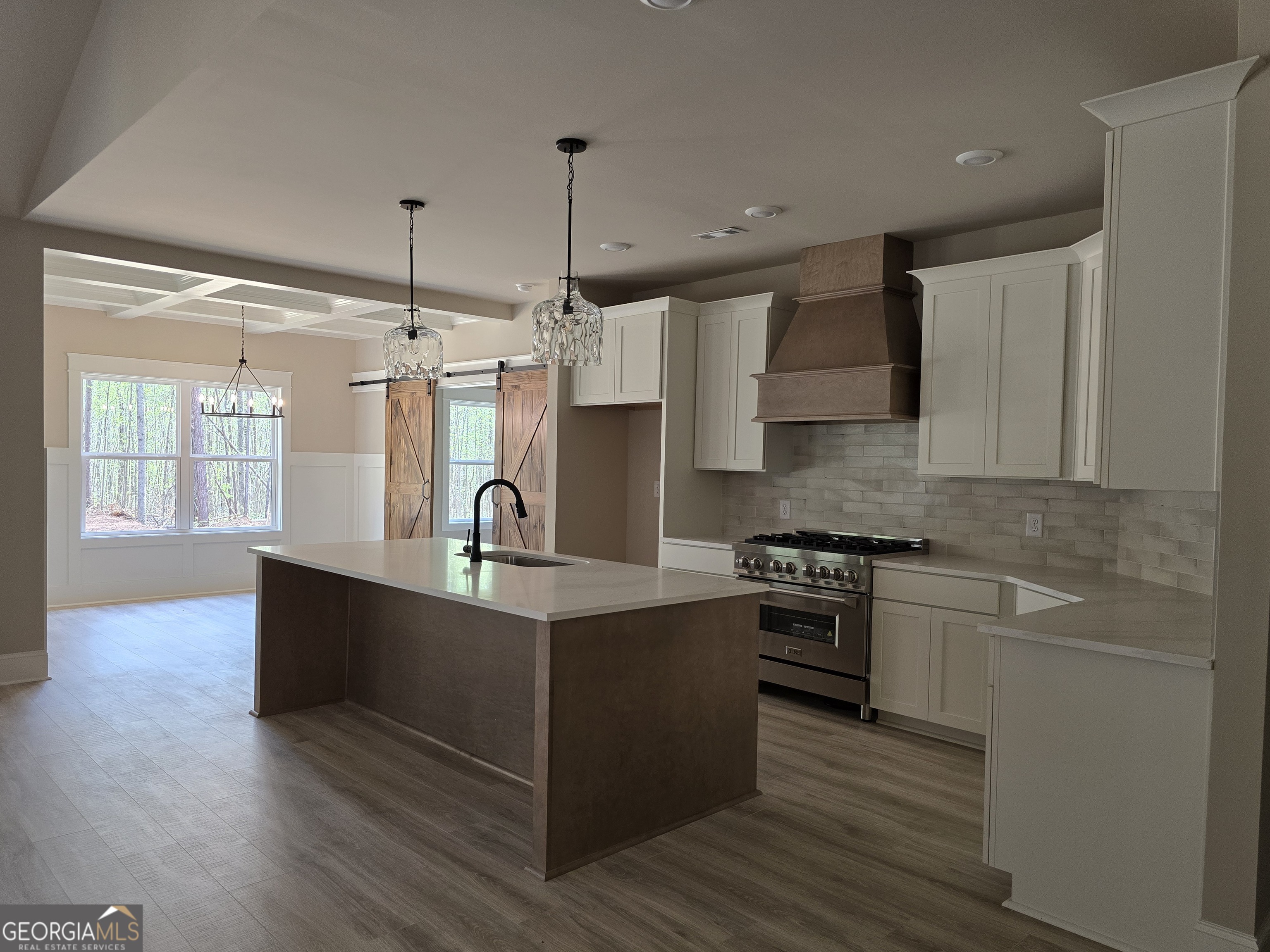 1620 Bar J Road Temple, GA 30179 - Photo 23 of 54 a kitchen with stainless steel appliances granite countertop a sink a stove and a wooden floors