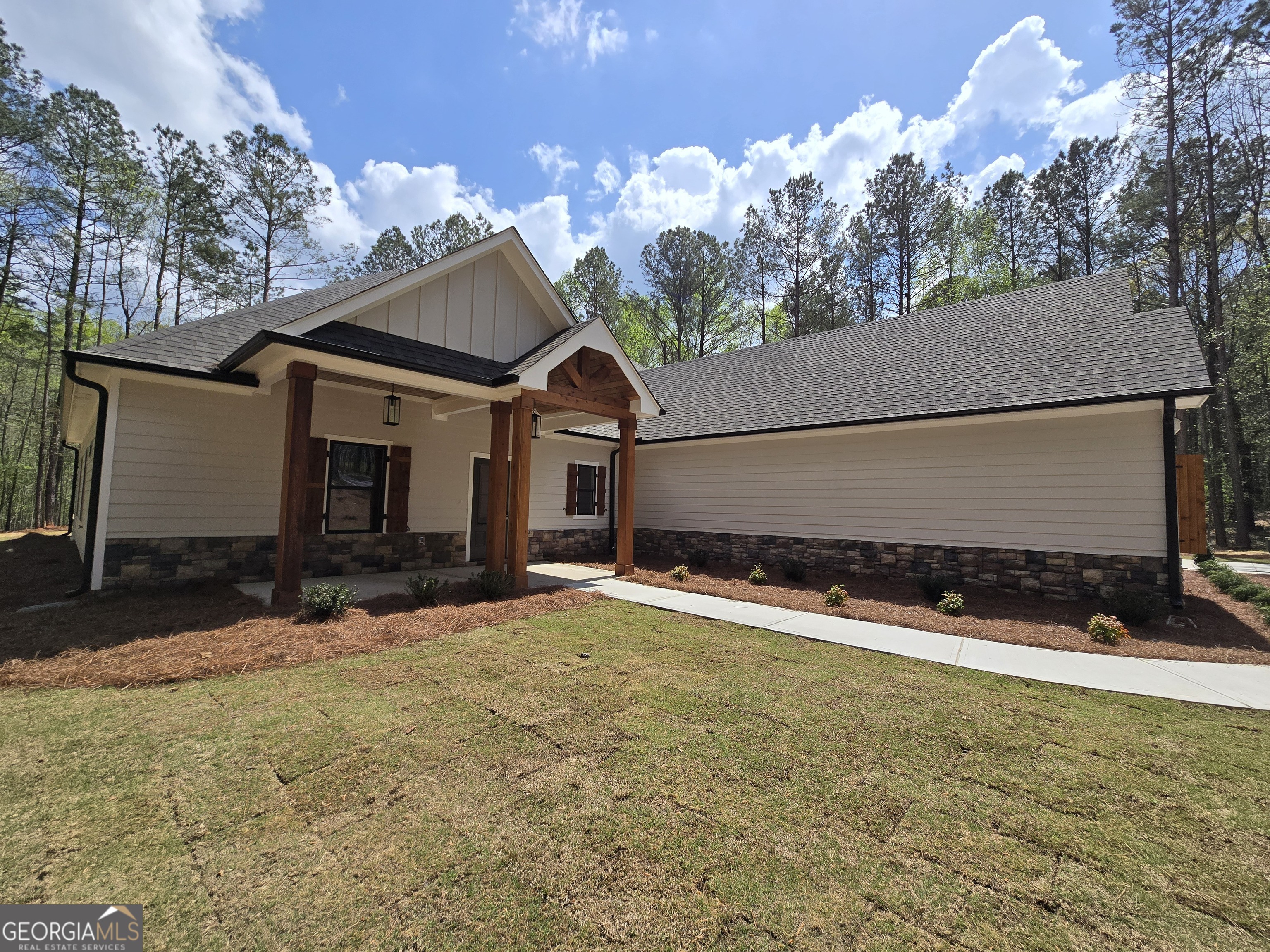 1620 Bar J Road Temple, GA 30179 - Photo 3 of 54 a house with trees in the background