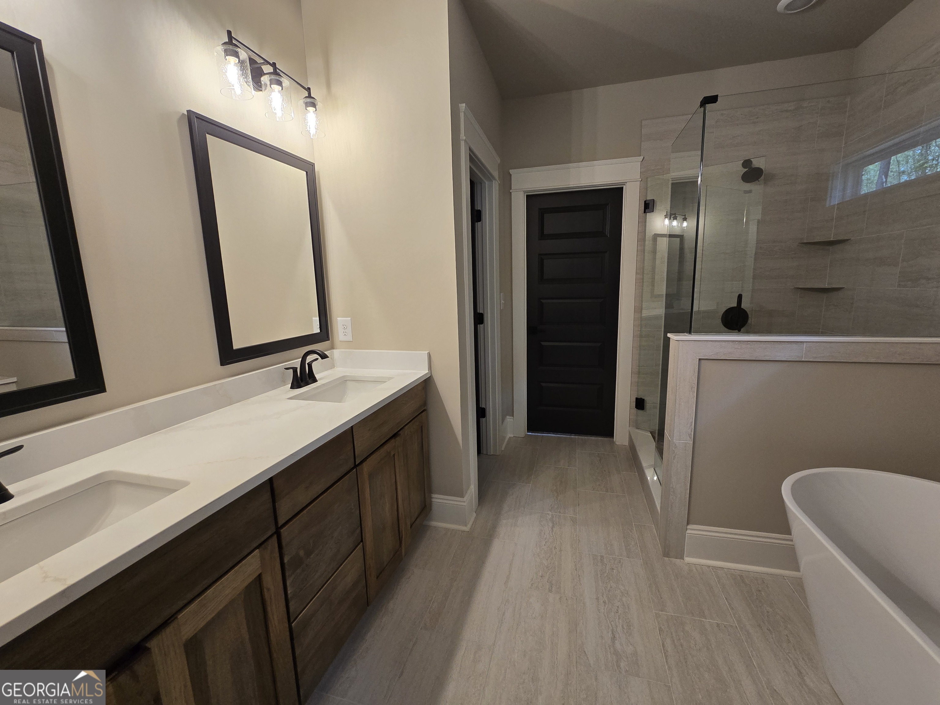 1620 Bar J Road Temple, GA 30179 - Photo 31 of 54 a spacious bathroom with a double vanity sink a mirror and a bathtub