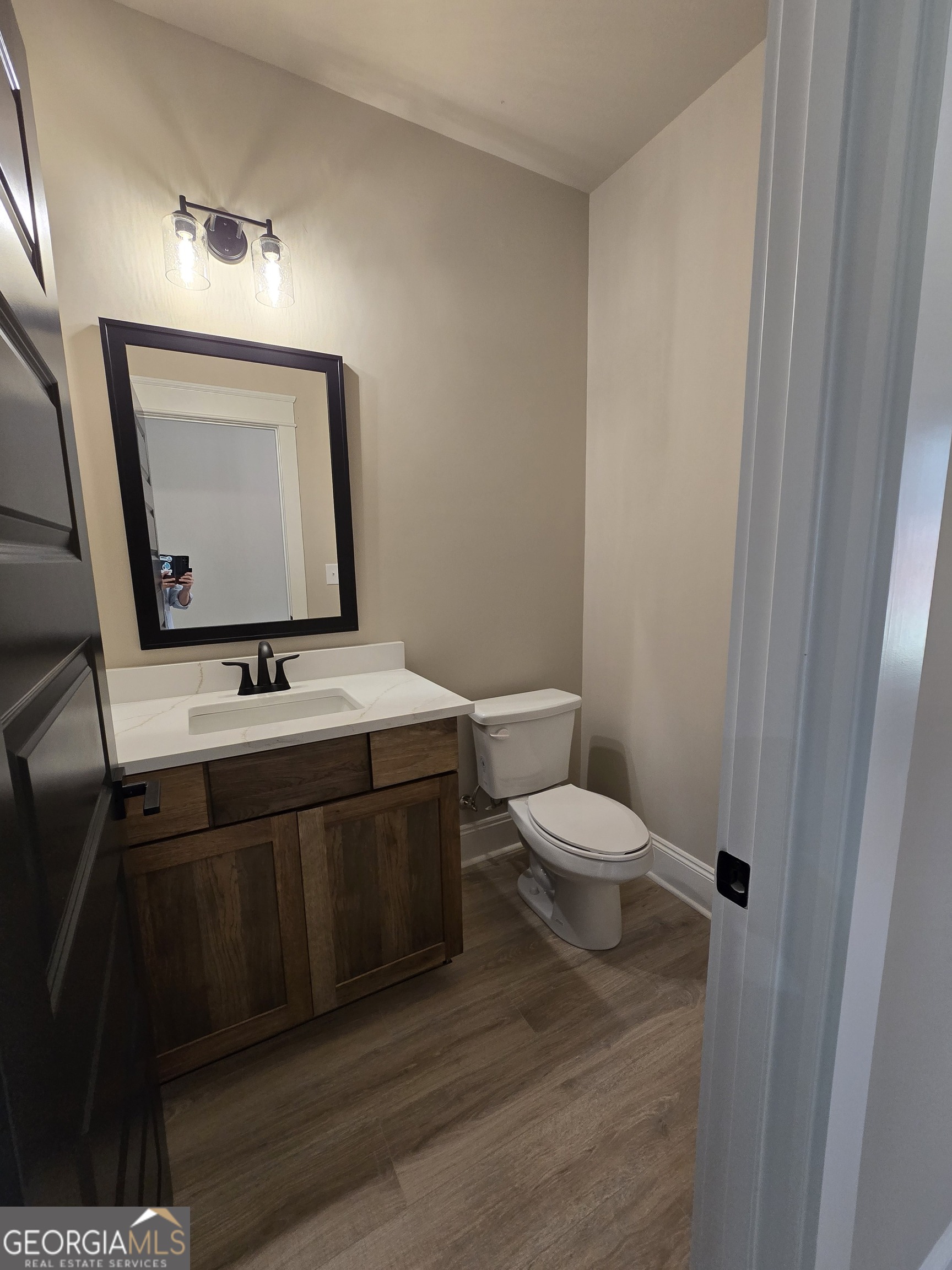 1620 Bar J Road Temple, GA 30179 - Photo 34 of 54 a bathroom with a toilet sink and mirror