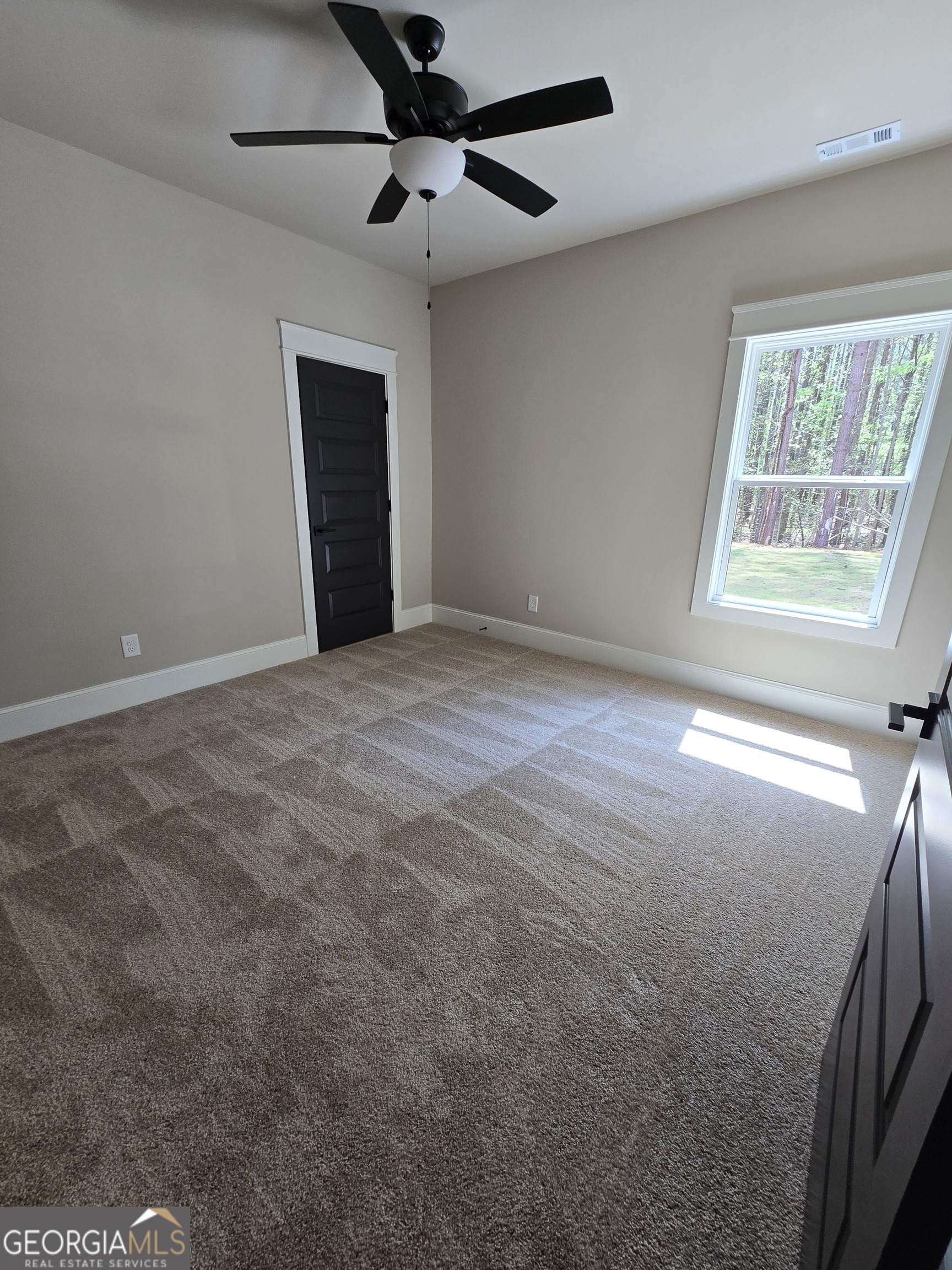 1620 Bar J Road Temple, GA 30179 - Photo 38 of 73 an empty room with windows and fan
