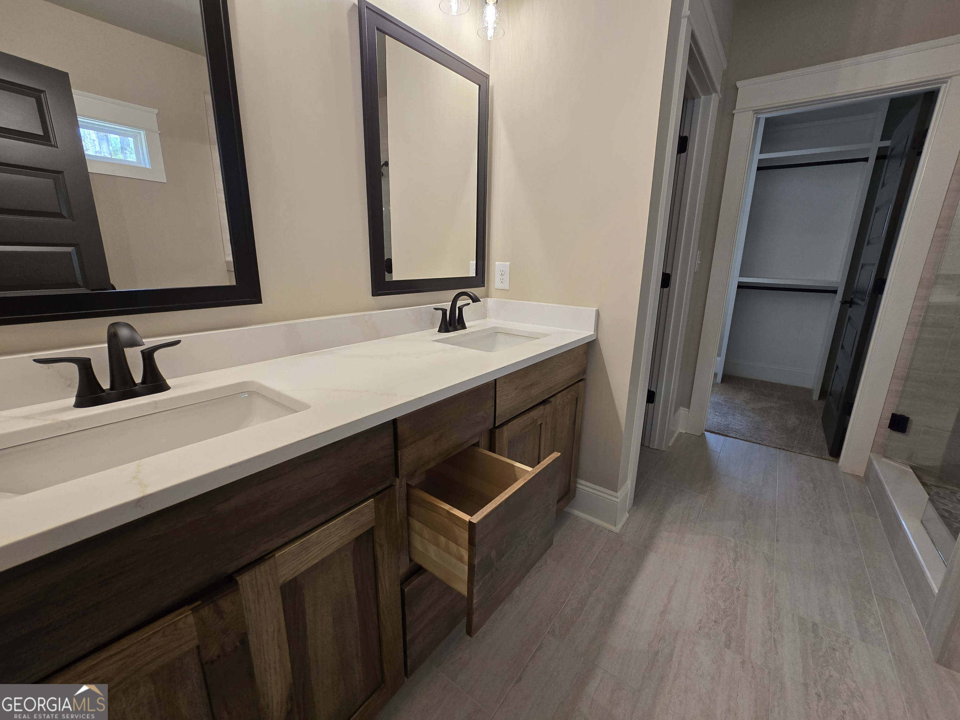 1620 Bar J Road Temple, GA 30179 - Photo 44 of 73 a bathroom with a double vanity sink and two mirror