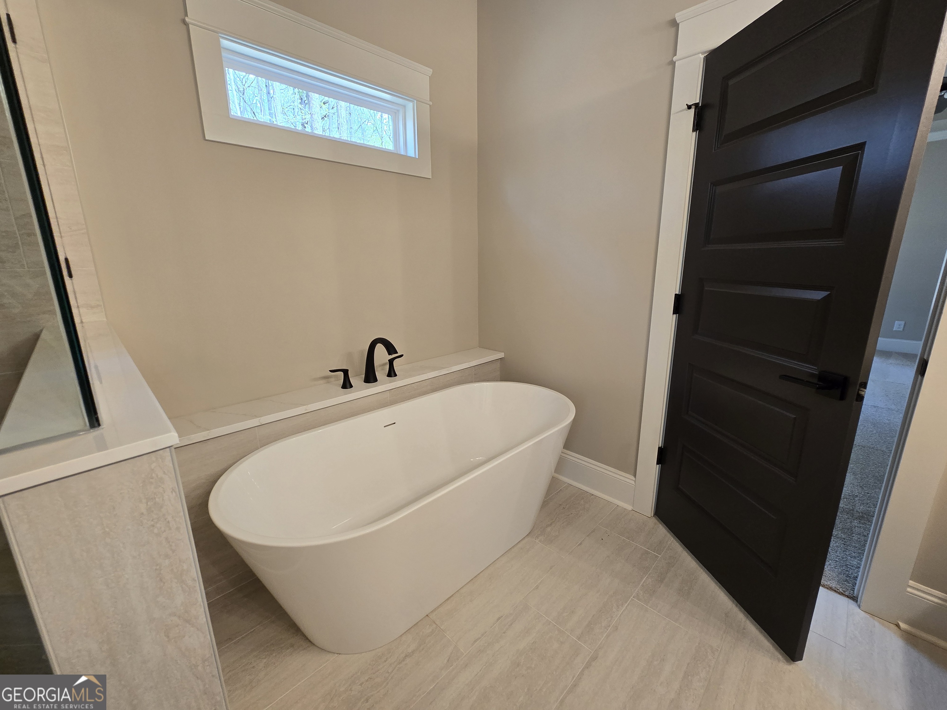1620 Bar J Road Temple, GA 30179 - Photo 45 of 73 a white bath tub sitting in a bathroom
