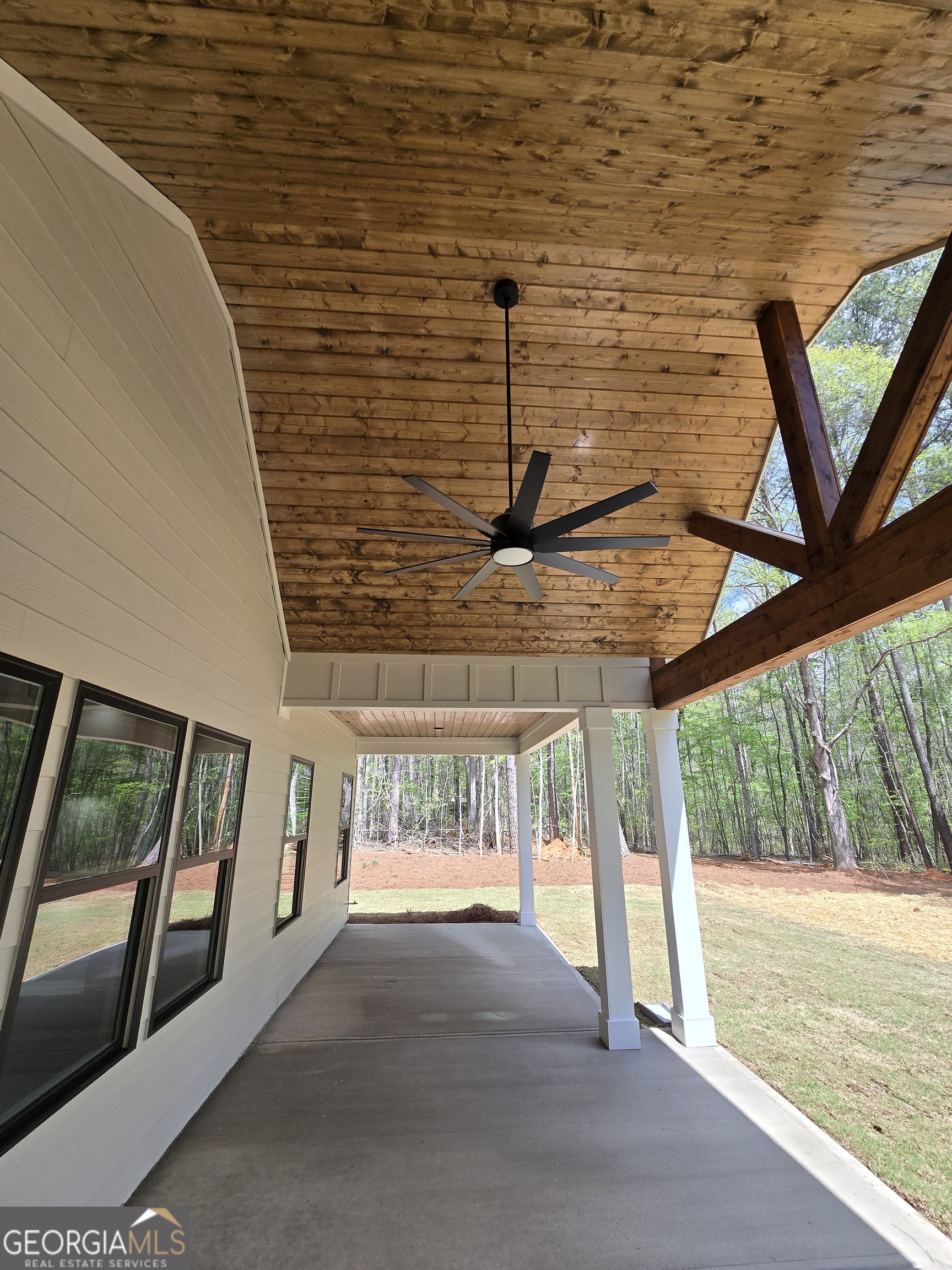 1620 Bar J Road Temple, GA 30179 - Photo 45 of 54 a view of a porch with furniture and floor to ceiling window