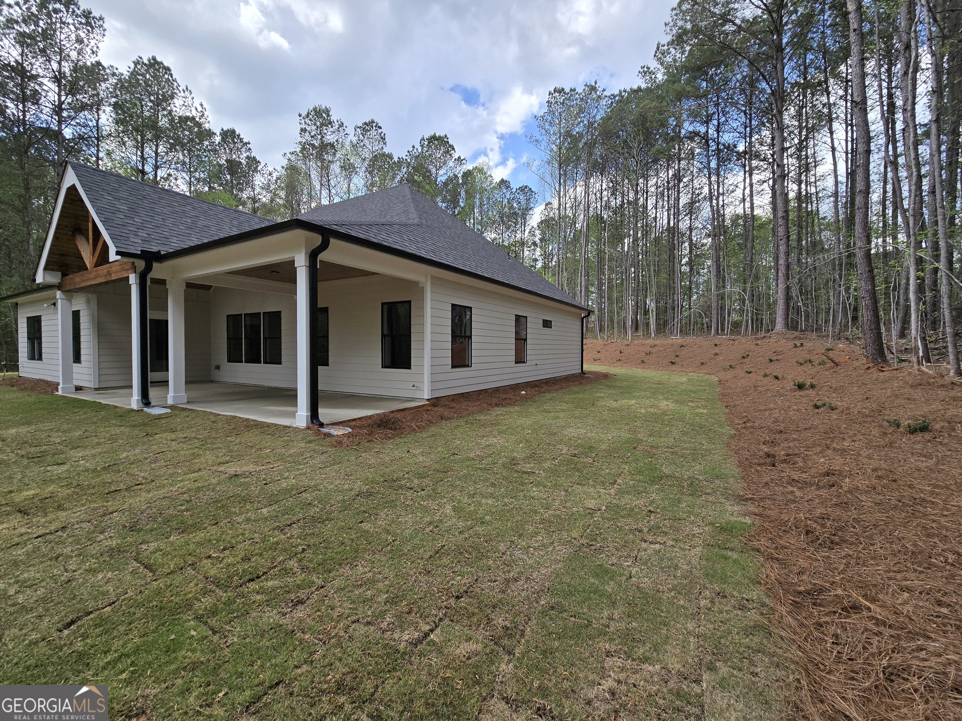 1620 Bar J Road Temple, GA 30179 - Photo 50 of 54 a view of a house with a backyard and trees