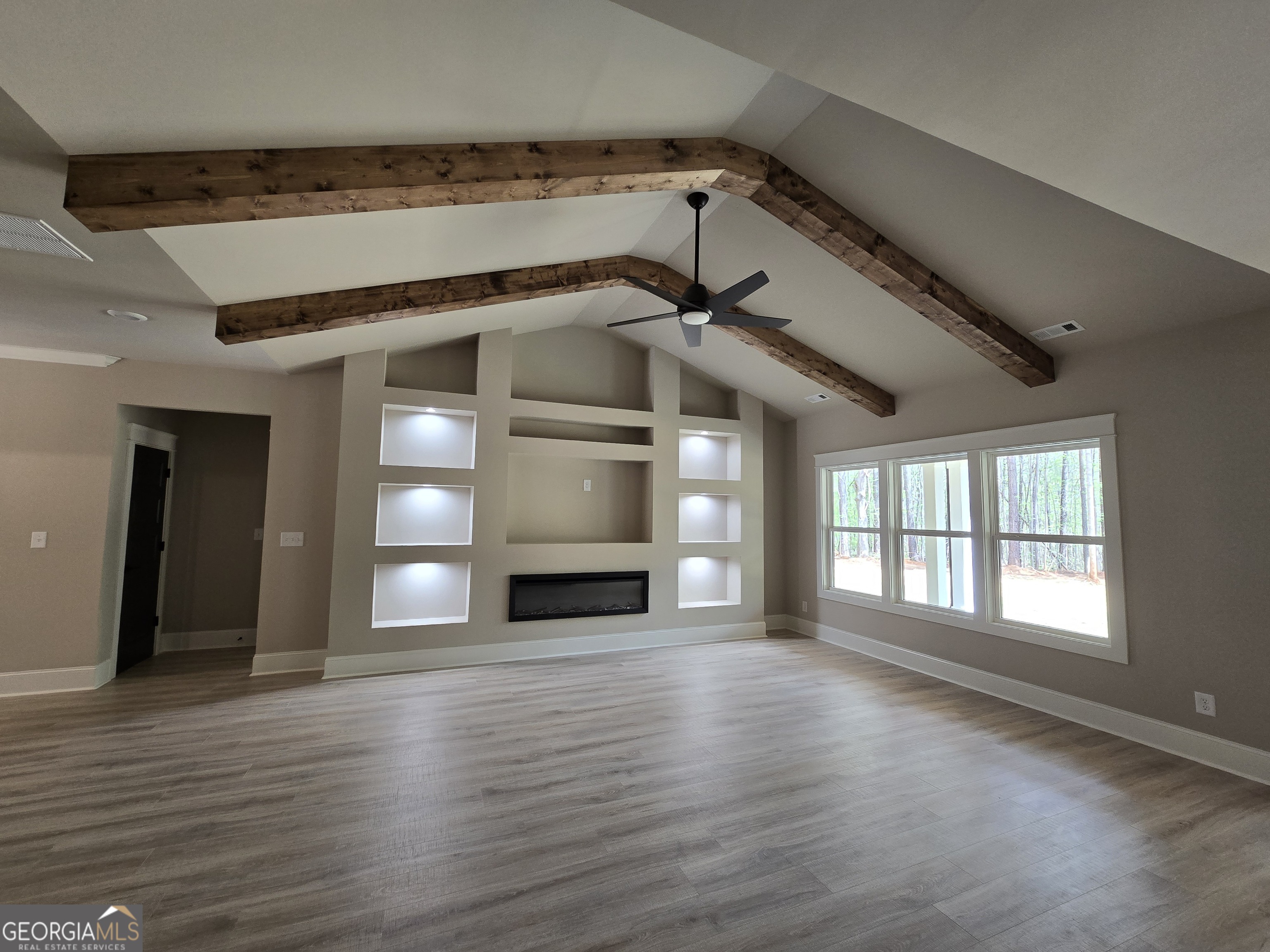 1620 Bar J Road Temple, GA 30179 - Photo 55 of 73 a view of an empty room with wooden floor and a window