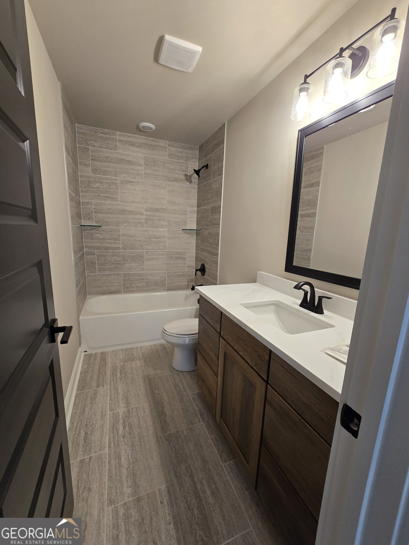 1620 Bar J Road Temple, GA 30179 - Photo 9 of 54 a bathroom with a bathtub a sink and a mirror