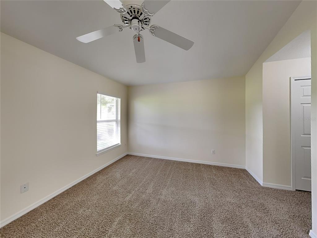 3024 Andover Court Mount Dora, FL 32757 - Photo 7 of 17 a view of an empty room with a window