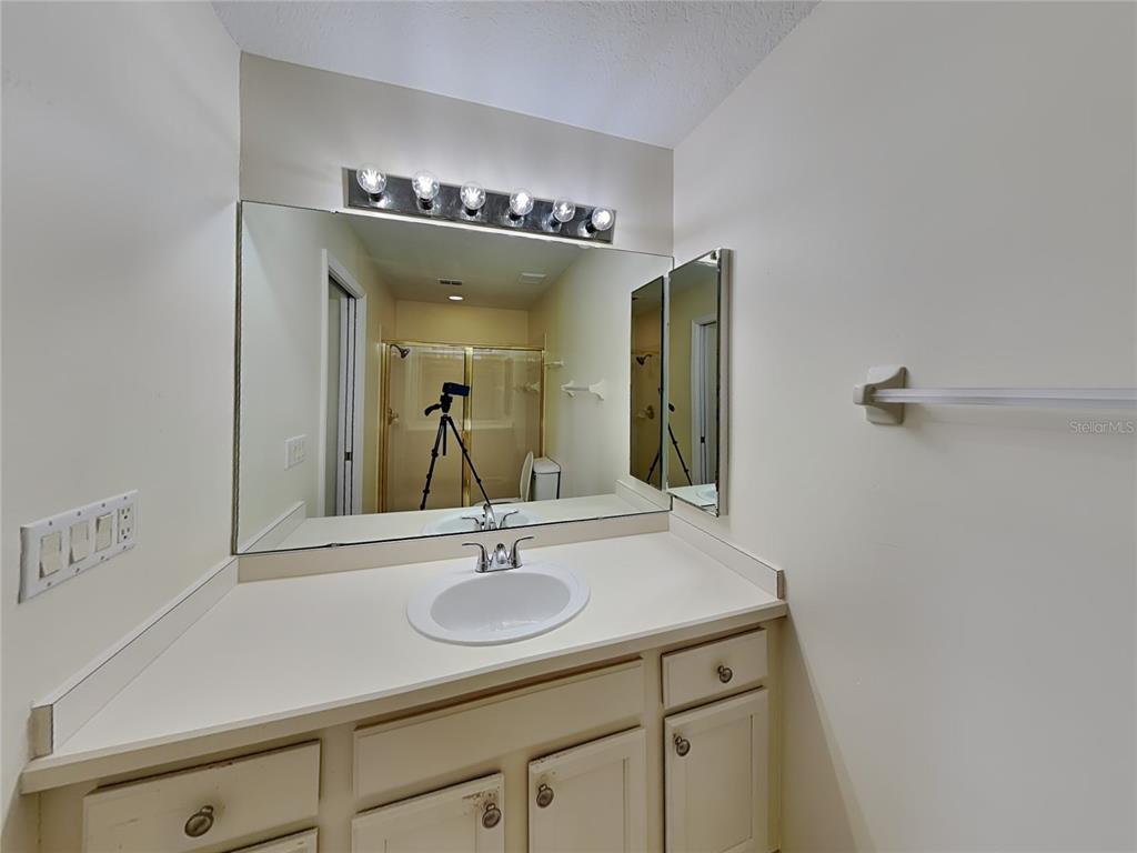 3024 Andover Court Mount Dora, FL 32757 - Photo 9 of 17 a bathroom with a sink and a mirror