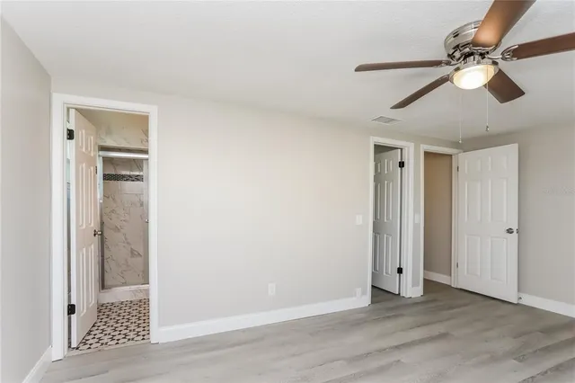 a view of an empty room with a window