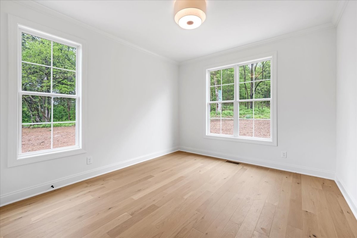 50 Lindsley Road Lebanon, TN 37090 - Photo 72 of 78 an empty room with wooden floor and windows