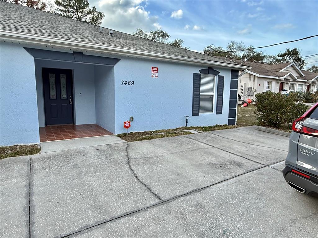 7469 Pond Circle Spring Hill, FL 34606 - Photo 1 of 1 an outdoor view of house