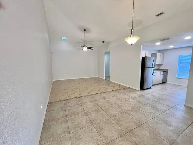 a view of a kitchen with a sink and a chandelier