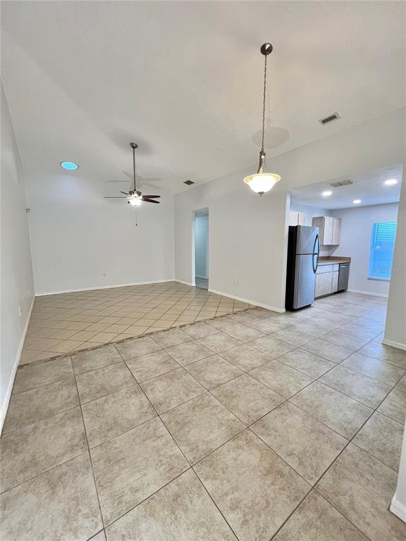 7469 Pond Circle Spring Hill, FL 34606 - Photo 5 of 22 a view of a kitchen with a sink and a chandelier