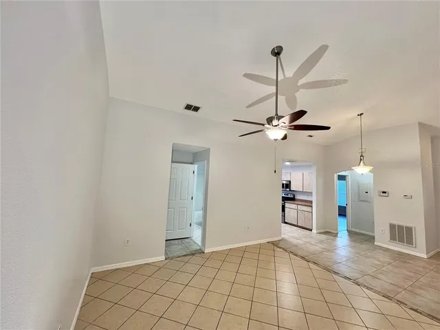 a kitchen with stainless steel appliances granite countertop a refrigerator a stove a sink and a refrigerator