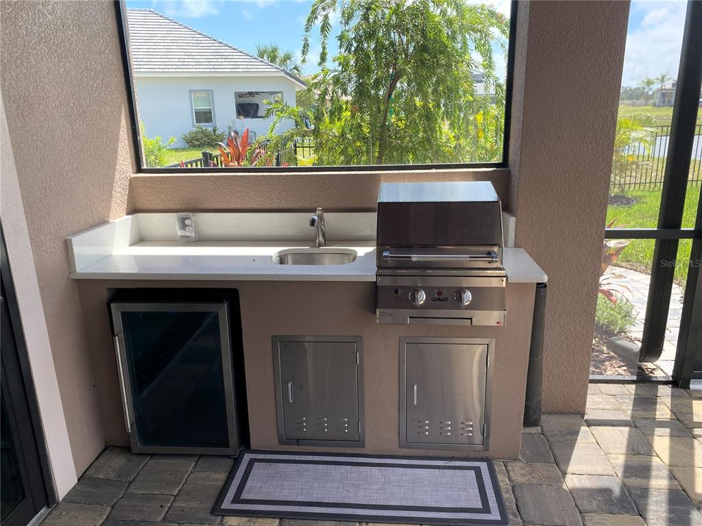 11 Rio Vista Drive Palm Coast, FL 32137 - Photo 23 of 38 a view of kitchen with microwave oven stove and sink