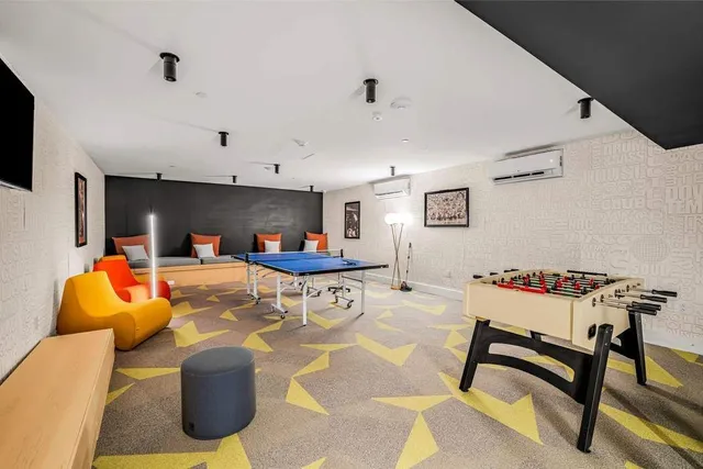 a dining room with furniture and wooden floor