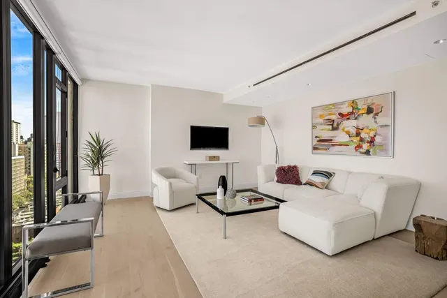 a picture of a bench in front of a wall