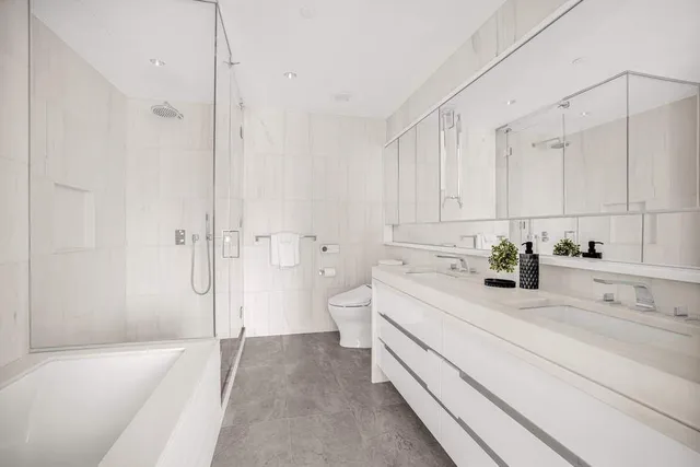 a spacious bedroom with a large bed and a couch