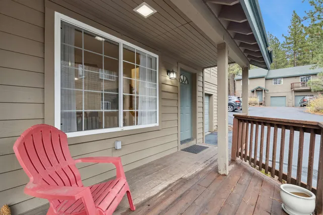 a view of a two chairs in the balcony