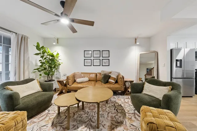 a living room with furniture and a lamp