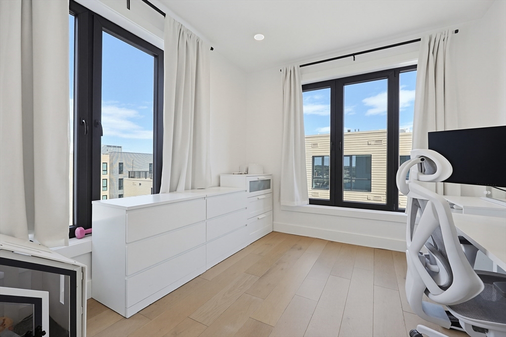 30 Penniman Road, Unit 605 Boston, MA 02134 - Photo 10 of 19 a view of room with window and wooden floor