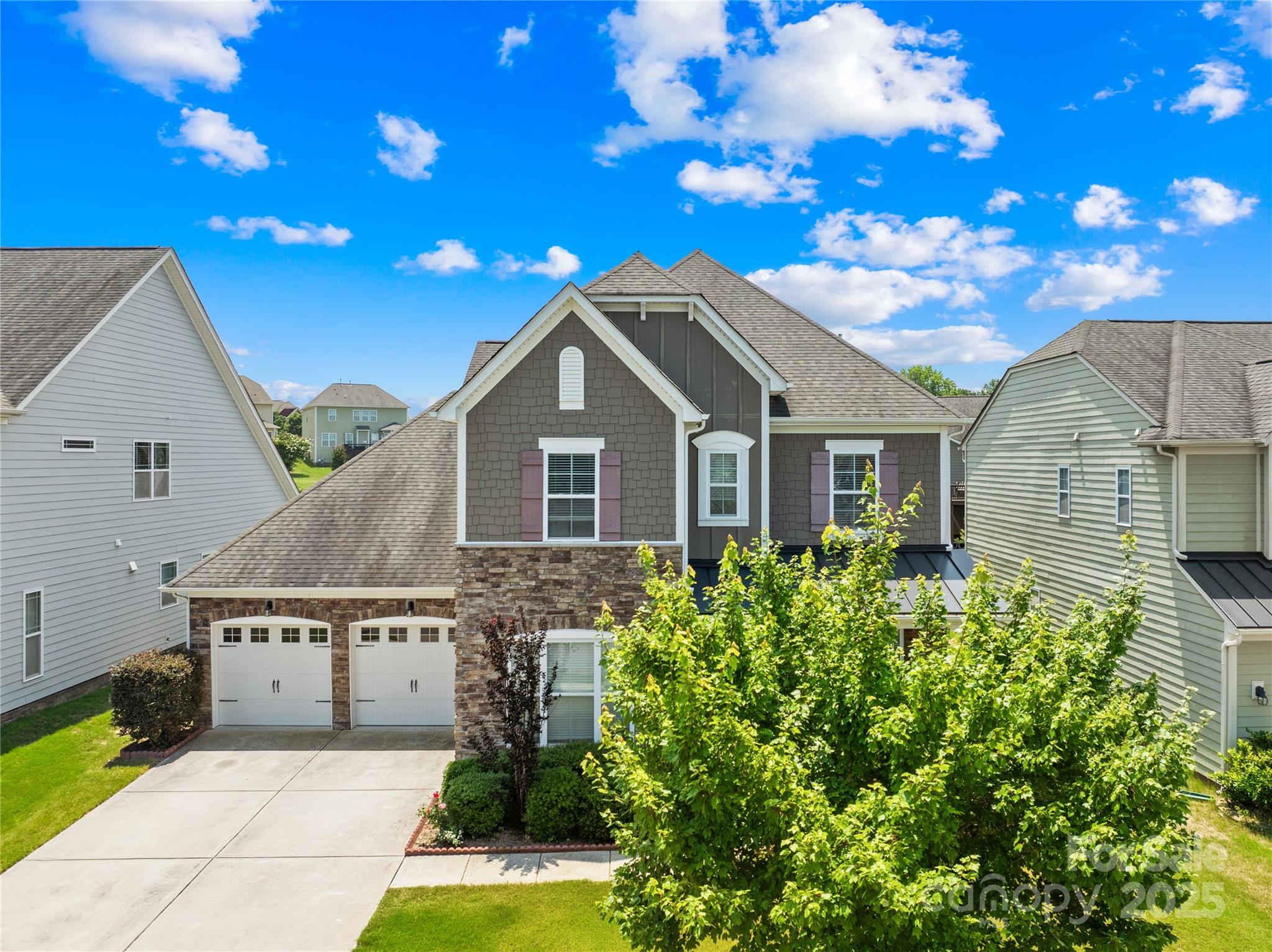 586 Brookhaven Drive Fort Mill, SC 29708 - Photo 1 of 47 a front view of a house with a garden