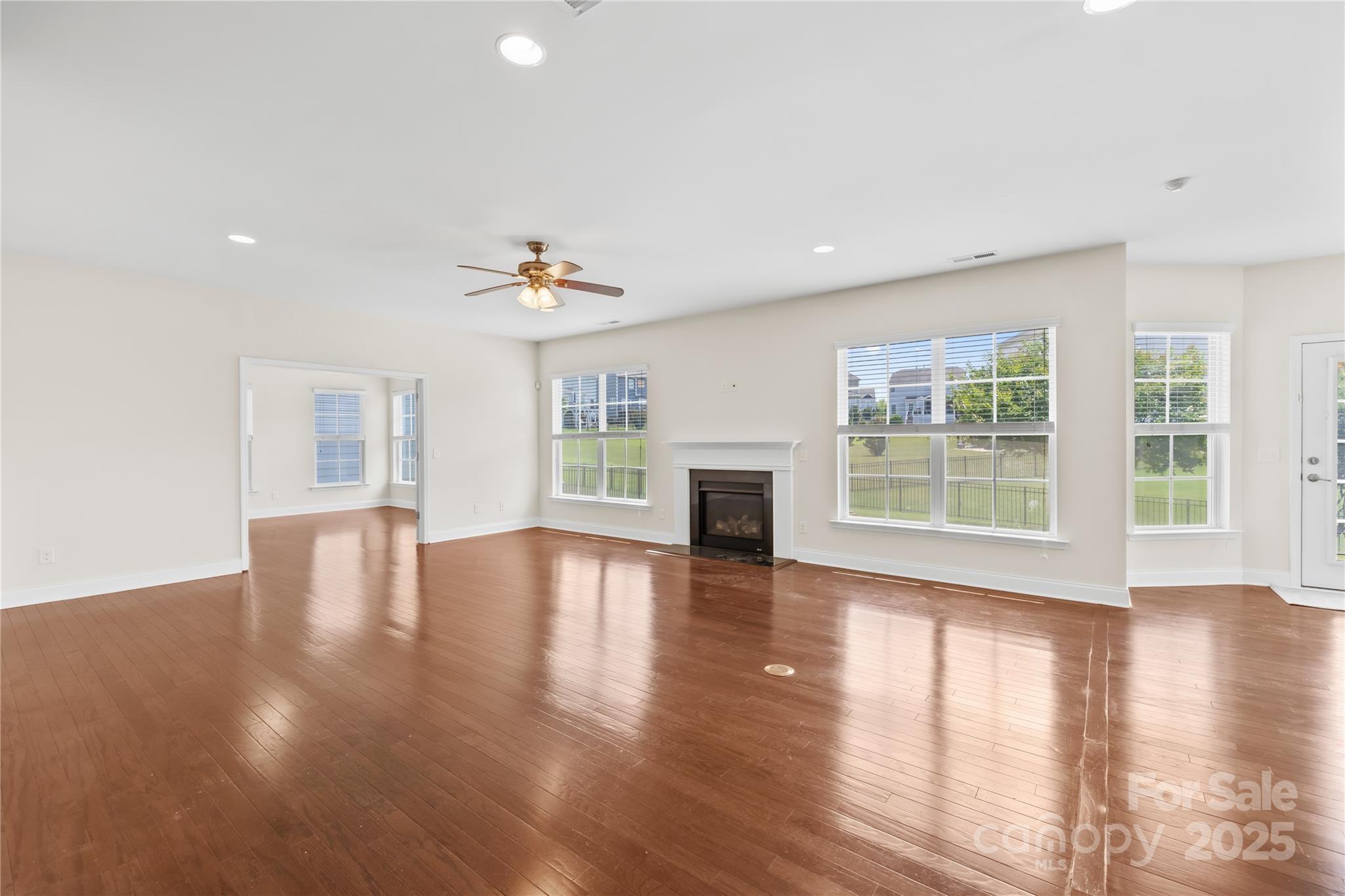 586 Brookhaven Drive Fort Mill, SC 29708 - Photo 11 of 47 a view of an empty room with wooden floor and a window