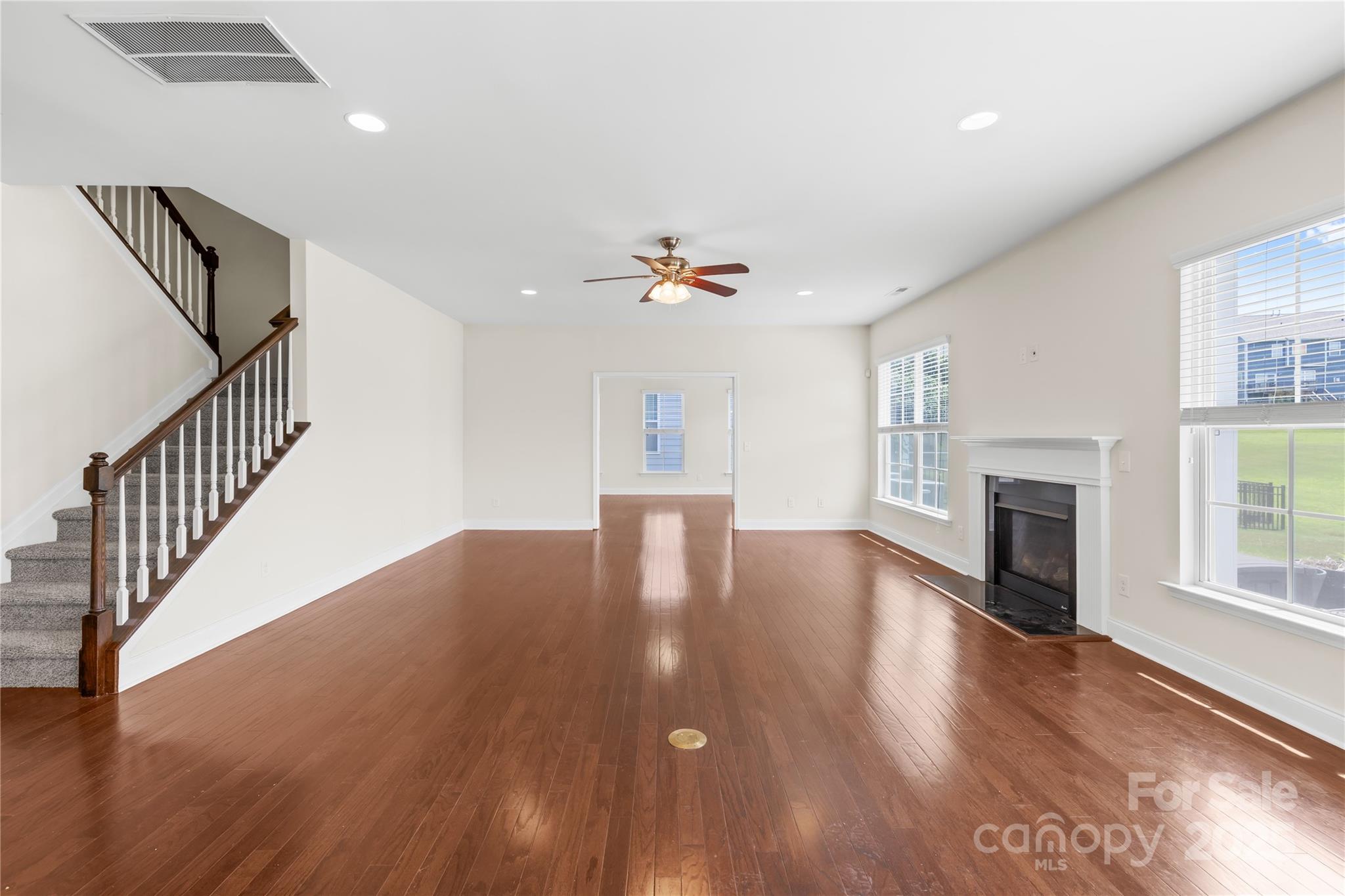 586 Brookhaven Drive Fort Mill, SC 29708 - Photo 20 of 47 a view of an empty room with wooden floor and a window